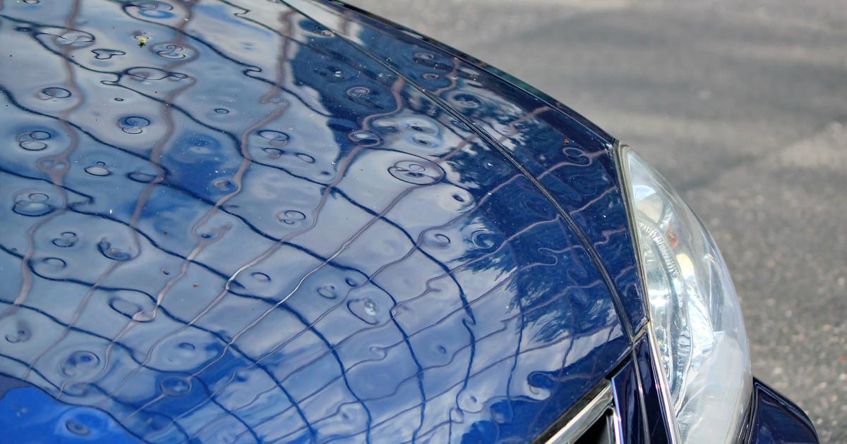 Car with hail damage being repaired